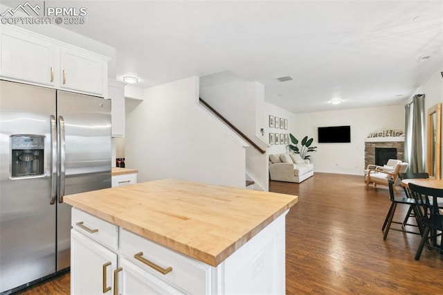 3748 Reindeer Cir, Colorado Springs, CO 80922 - kitchen with stainless steel refrigerator with ice dispenser, butcher block counters, dark wood-type flooring, and white cabinetry