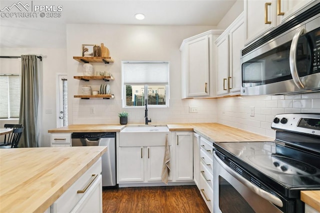 3748 Reindeer Cir, Colorado Springs, CO 80922 - kitchen featuring wooden counters, stainless steel appliances, a sink, backsplash, and recessed lighting