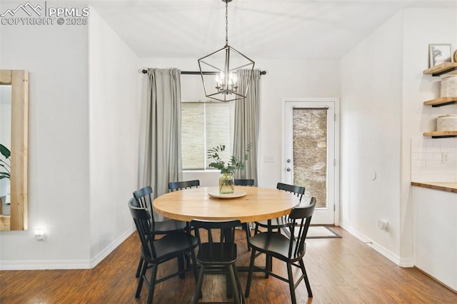 3748 Reindeer Cir, Colorado Springs, CO 80922 - dining space with a chandelier, wood finished floors, and baseboards