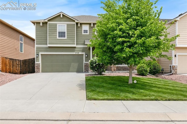 3748 Reindeer Cir, Colorado Springs, CO 80922 - view of front of property featuring stone siding, an attached garage, and concrete driveway