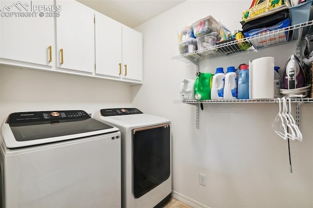 3748 Reindeer Cir, Colorado Springs, CO 80922 - laundry room with washing machine and dryer and cabinet space