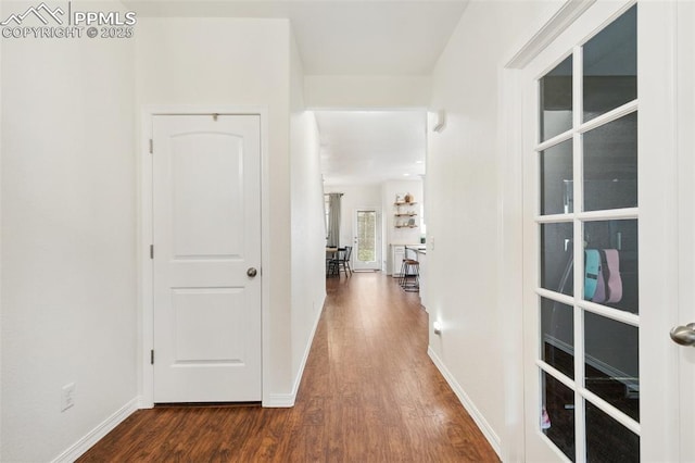 3748 Reindeer Cir, Colorado Springs, CO 80922 - hall with dark wood-type flooring and baseboards