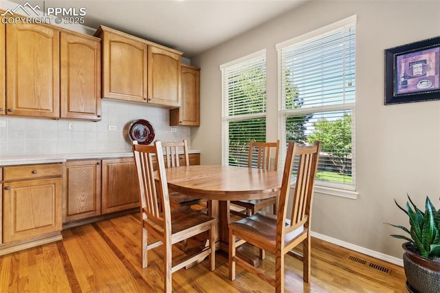 10290 Peach Blossom Trl, Colorado Springs, CO 80920 - dining room with light wood-style floors and baseboards