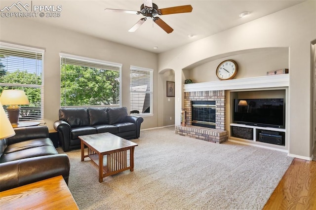 10290 Peach Blossom Trl, Colorado Springs, CO 80920 - living area with a ceiling fan, built in shelves, plenty of natural light, and arched walkways