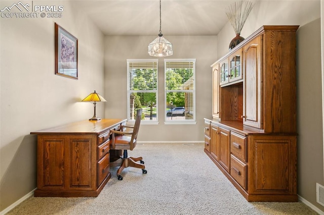 10290 Peach Blossom Trl, Colorado Springs, CO 80920 - home office with a chandelier and light carpet