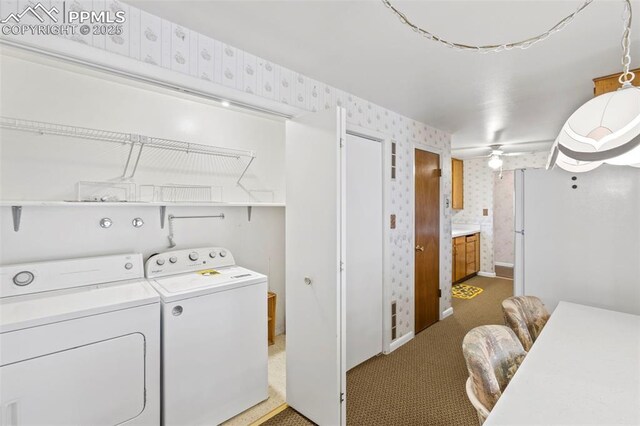 2043 Patrician Way, Colorado Springs, CO 80909 - laundry room with wallpapered walls, washer and clothes dryer, baseboards, and carpet