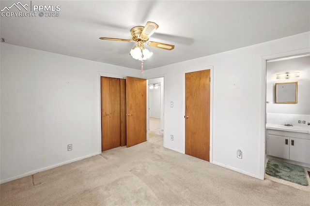 2043 Patrician Way, Colorado Springs, CO 80909 - unfurnished bedroom with light colored carpet, connected bathroom, baseboards, and ceiling fan