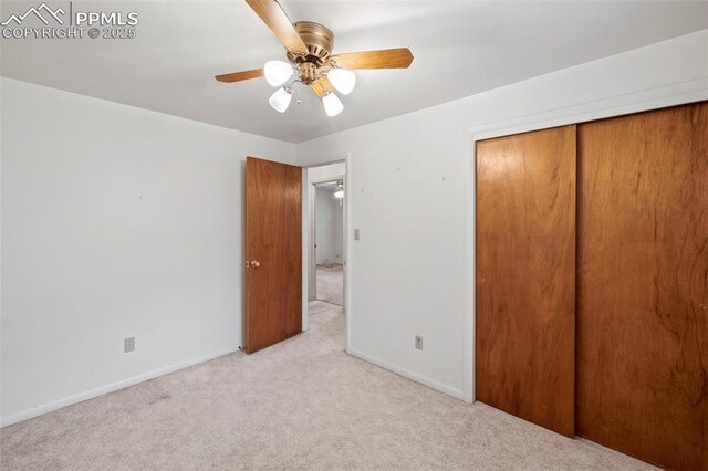 2043 Patrician Way, Colorado Springs, CO 80909 - unfurnished bedroom featuring light colored carpet, baseboards, a closet, and ceiling fan