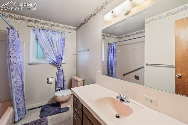 2043 Patrician Way, Colorado Springs, CO 80909 - bathroom with vanity, toilet, shower / bathtub combination with curtain, and baseboards