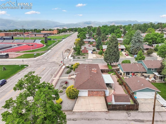 2043 Patrician Way, Colorado Springs, CO 80909 - aerial perspective of suburban area with a mountain backdrop