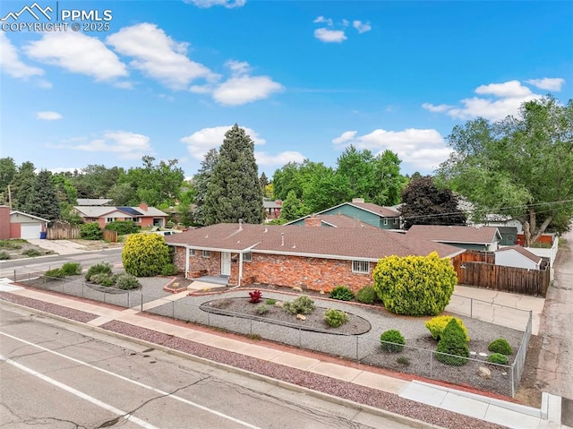 2043 Patrician Way, Colorado Springs, CO 80909 - single story home featuring view of wooded area