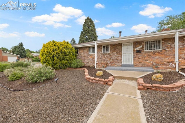 2043 Patrician Way, Colorado Springs, CO 80909 - view of front of property featuring brick siding