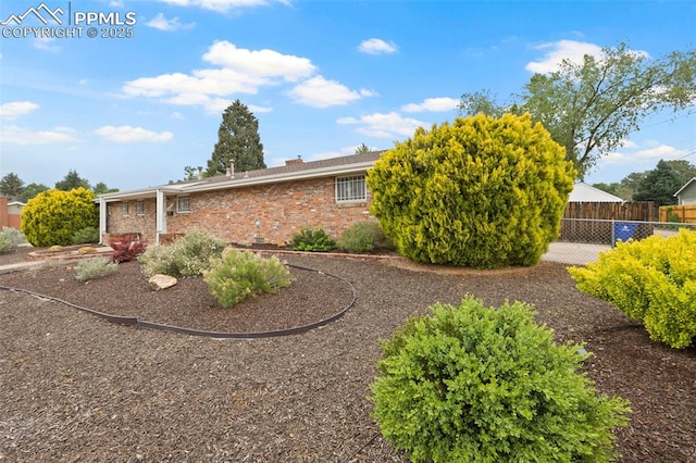 2043 Patrician Way, Colorado Springs, CO 80909 - view of property exterior featuring brick siding