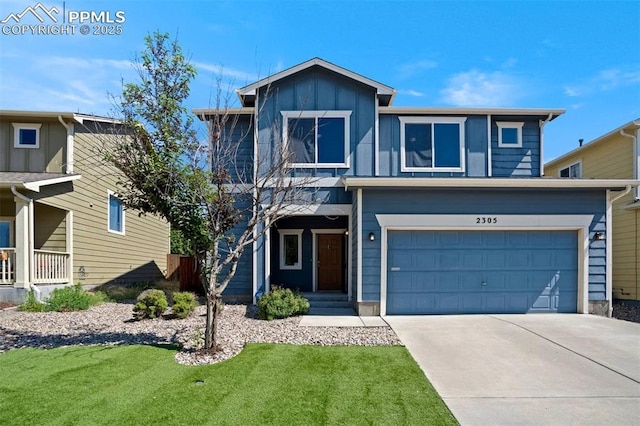 2305 Reed Grass Way, Colorado Springs, CO 80915 - view of front of home featuring driveway, an attached garage, a front lawn, and board and batten siding
