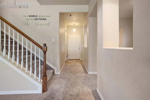 2305 Reed Grass Way, Colorado Springs, CO 80915 - hallway featuring carpet flooring, stairs, and baseboards