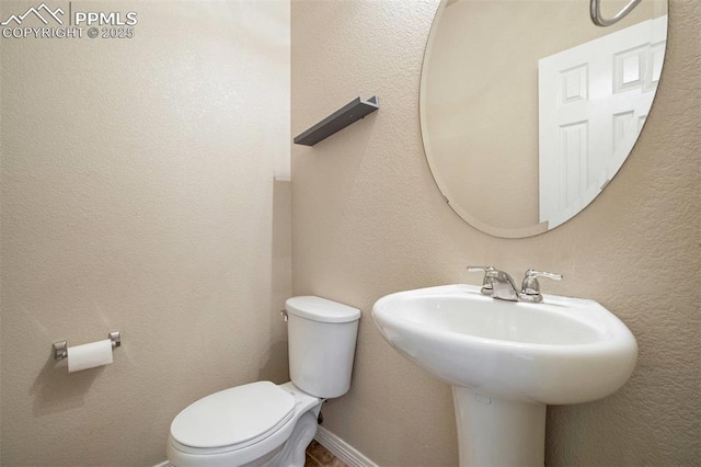 2305 Reed Grass Way, Colorado Springs, CO 80915 - bathroom featuring toilet and a sink