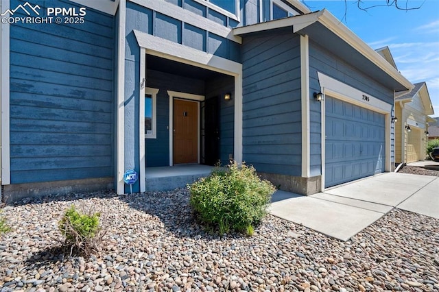2305 Reed Grass Way, Colorado Springs, CO 80915 - view of exterior entry featuring a garage