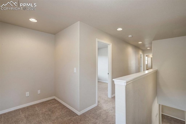 2305 Reed Grass Way, Colorado Springs, CO 80915 - hall featuring light colored carpet, recessed lighting, an upstairs landing, and baseboards