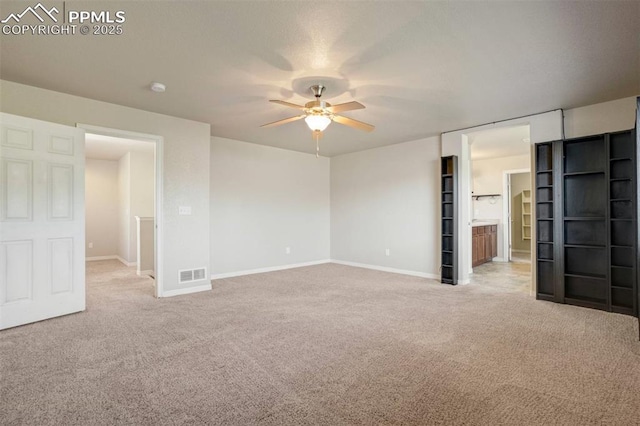 2305 Reed Grass Way, Colorado Springs, CO 80915 - unfurnished bedroom featuring light colored carpet, baseboards, and ceiling fan