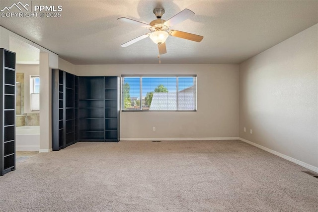 2305 Reed Grass Way, Colorado Springs, CO 80915 - carpeted empty room featuring ceiling fan, a textured ceiling, and baseboards