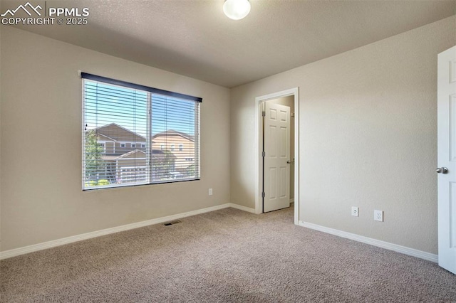 2305 Reed Grass Way, Colorado Springs, CO 80915 - unfurnished room featuring light carpet and baseboards