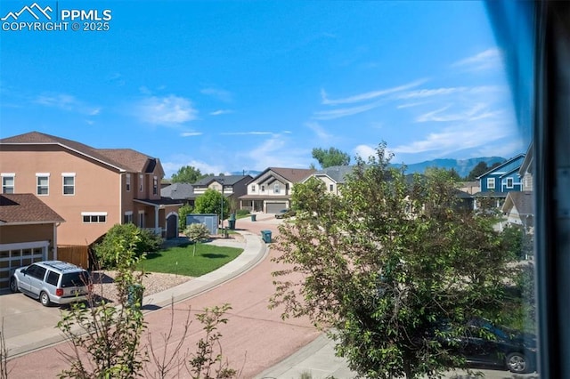 2305 Reed Grass Way, Colorado Springs, CO 80915 - view of community with a residential view, driveway, and a garage