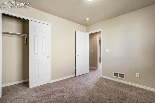 2305 Reed Grass Way, Colorado Springs, CO 80915 - unfurnished bedroom with carpet floors, baseboards, and a closet
