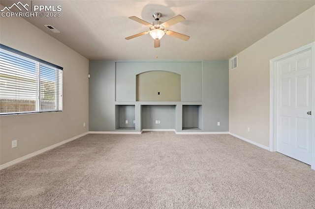 2305 Reed Grass Way, Colorado Springs, CO 80915 - unfurnished living room with ceiling fan, carpet, baseboards, and built in features