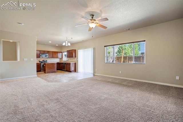 2305 Reed Grass Way, Colorado Springs, CO 80915 - unfurnished living room featuring baseboards, light colored carpet, ceiling fan, and recessed lighting