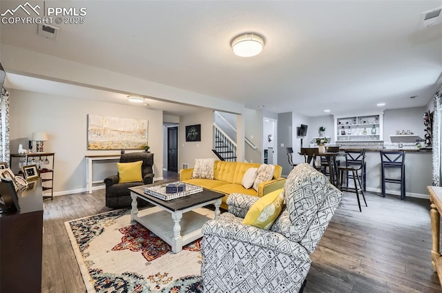 8084 Cinnamon Ct, Colorado Springs, CO 80927 - living area with stairs, wood finished floors, and baseboards