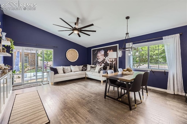 8084 Cinnamon Ct, Colorado Springs, CO 80927 - dining room with vaulted ceiling, wood finished floors, a ceiling fan, a chandelier, and baseboards