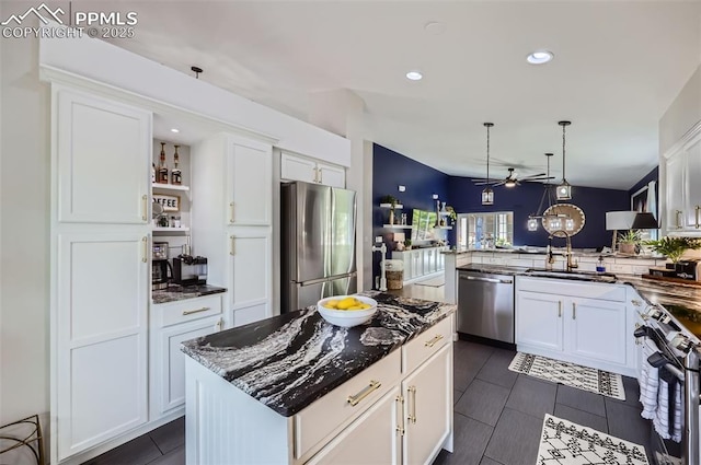 8084 Cinnamon Ct, Colorado Springs, CO 80927 - kitchen with stainless steel appliances, a sink, ceiling fan, white cabinetry, and recessed lighting