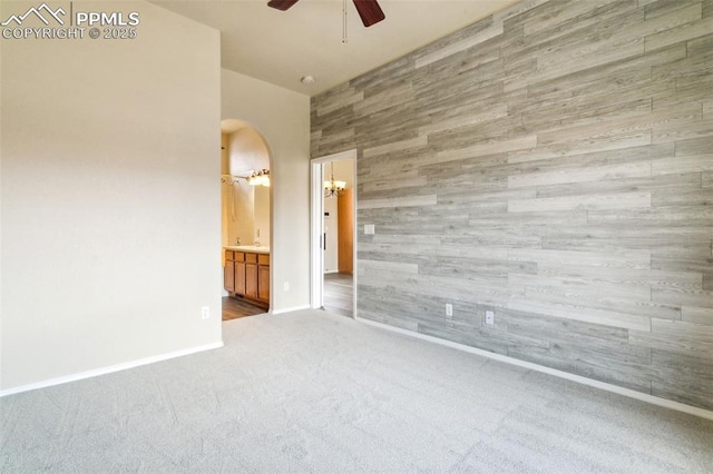 4710 Sand Mountain Pt, Colorado Springs, CO 80923 - spare room with a ceiling fan, carpet, arched walkways, and a chandelier