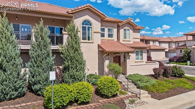 4710 Sand Mountain Pt, Colorado Springs, CO 80923 - view of front facade with a tile roof and stucco siding