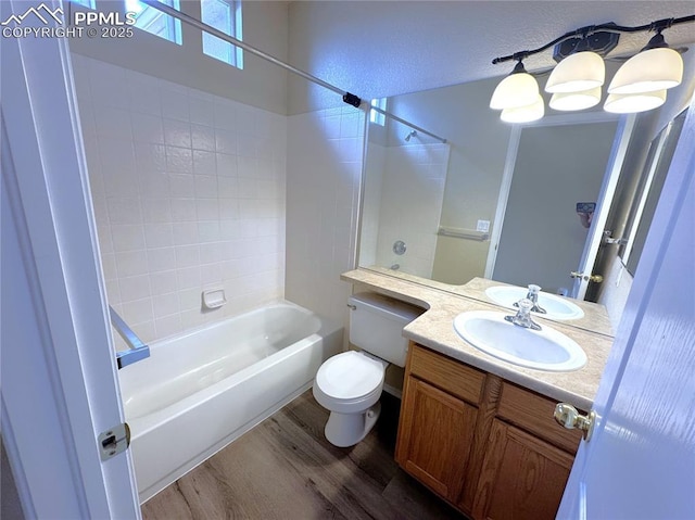 4710 Sand Mountain Pt, Colorado Springs, CO 80923 - bathroom with wood finished floors, shower / bathtub combination, and vanity