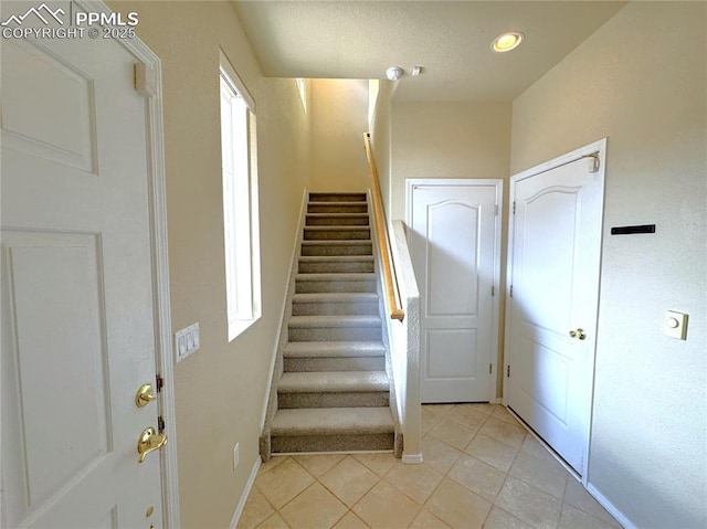 4710 Sand Mountain Pt, Colorado Springs, CO 80923 - stairs with tile patterned flooring and recessed lighting