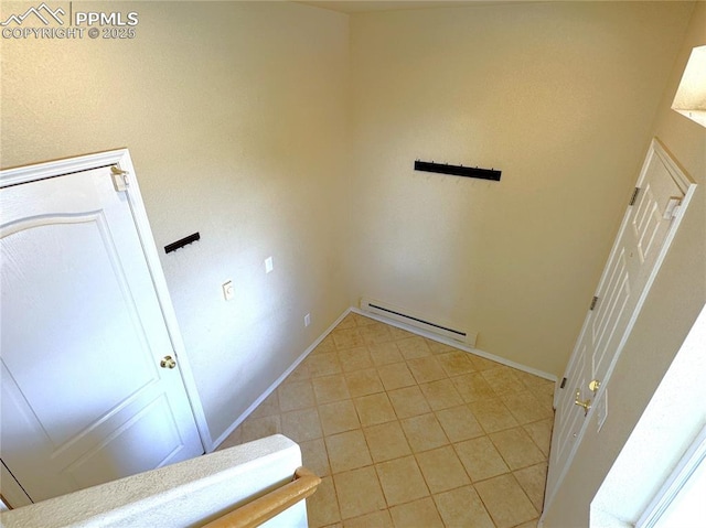 4710 Sand Mountain Pt, Colorado Springs, CO 80923 - laundry area featuring a baseboard radiator and light tile patterned flooring