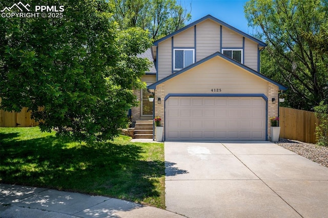 4125 Cricket Ct, Colorado Springs, CO 80918 - view of front of property featuring concrete driveway, an attached garage, and brick siding
