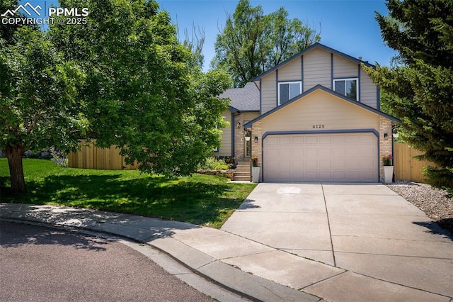 4125 Cricket Ct, Colorado Springs, CO 80918 - view of front facade featuring an attached garage, concrete driveway, and brick siding