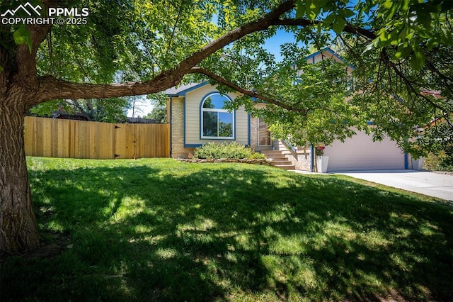 4125 Cricket Ct, Colorado Springs, CO 80918 - view of front of property featuring concrete driveway, brick siding, and an attached garage