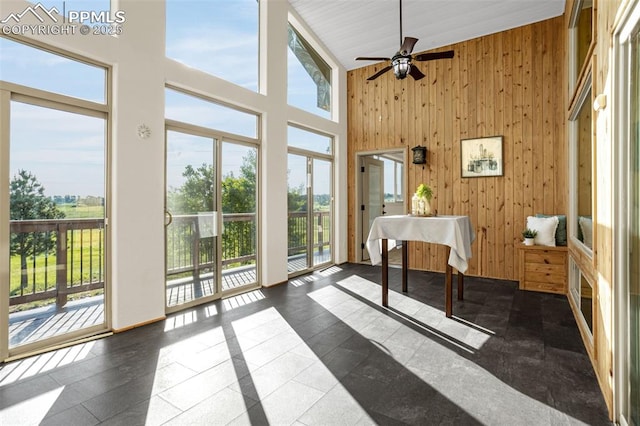 16255 Ridge Run Dr, Colorado Springs, CO 80908 - sunroom featuring a high ceiling and wood walls
