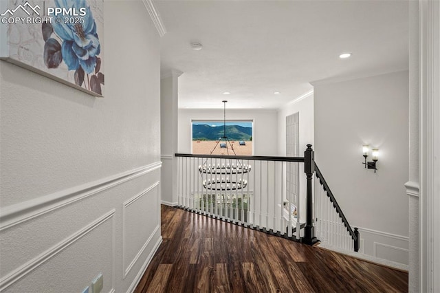 206 Luxury Ln, Colorado Springs, CO 80921 - hallway with ornamental molding, a chandelier, wood finished floors, an upstairs landing, and recessed lighting