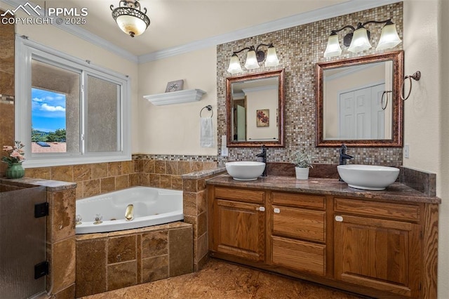 206 Luxury Ln, Colorado Springs, CO 80921 - full bathroom featuring a bath, ornamental molding, and double vanity