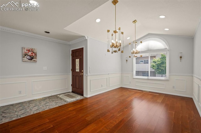 206 Luxury Ln, Colorado Springs, CO 80921 - entryway with hardwood / wood-style flooring, a chandelier, a wainscoted wall, crown molding, and recessed lighting