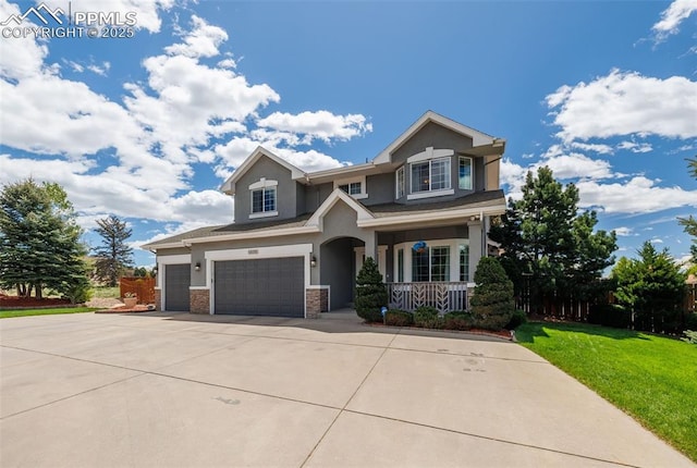 14095 Gleneagle Dr, Colorado Springs, CO 80921 - craftsman inspired home featuring covered porch, stucco siding, concrete driveway, a garage, and a front yard