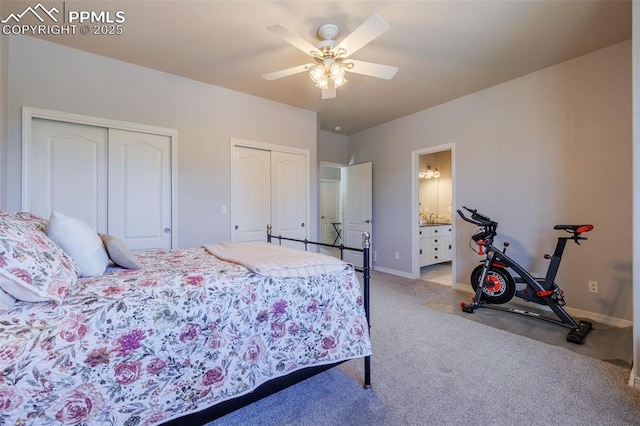 14095 Gleneagle Dr, Colorado Springs, CO 80921 - carpeted bedroom with two closets, ensuite bath, and ceiling fan