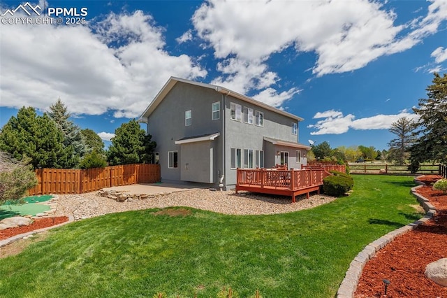 14095 Gleneagle Dr, Colorado Springs, CO 80921 - back of house featuring stucco siding, a fenced backyard, a patio area, and a wooden deck