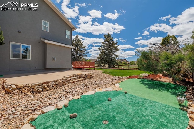 14095 Gleneagle Dr, Colorado Springs, CO 80921 - view of yard featuring a patio, a putting green, and a deck