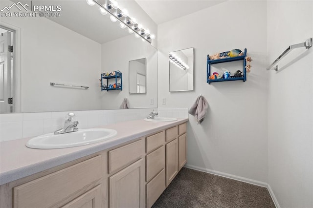 1749 Victorian Pt, Colorado Springs, CO 80905 - bathroom with double vanity and baseboards
