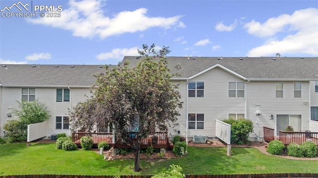 1749 Victorian Pt, Colorado Springs, CO 80905 - back of house featuring a wooden deck and a yard